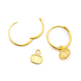 Gold-toned hoop earrings with small pumpkin charms, displayed on a clean white background.