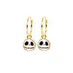 A pair of gold hoop earrings with Jack Skellington skull charms, shown on a plain white background.