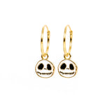 A pair of gold hoop earrings with Jack Skellington skull charms, shown on a plain white background.