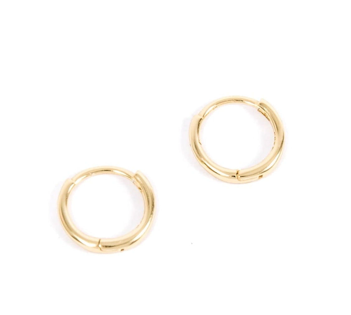 Gold hoop earrings on a white background