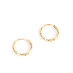 Gold hoop earrings on a white background