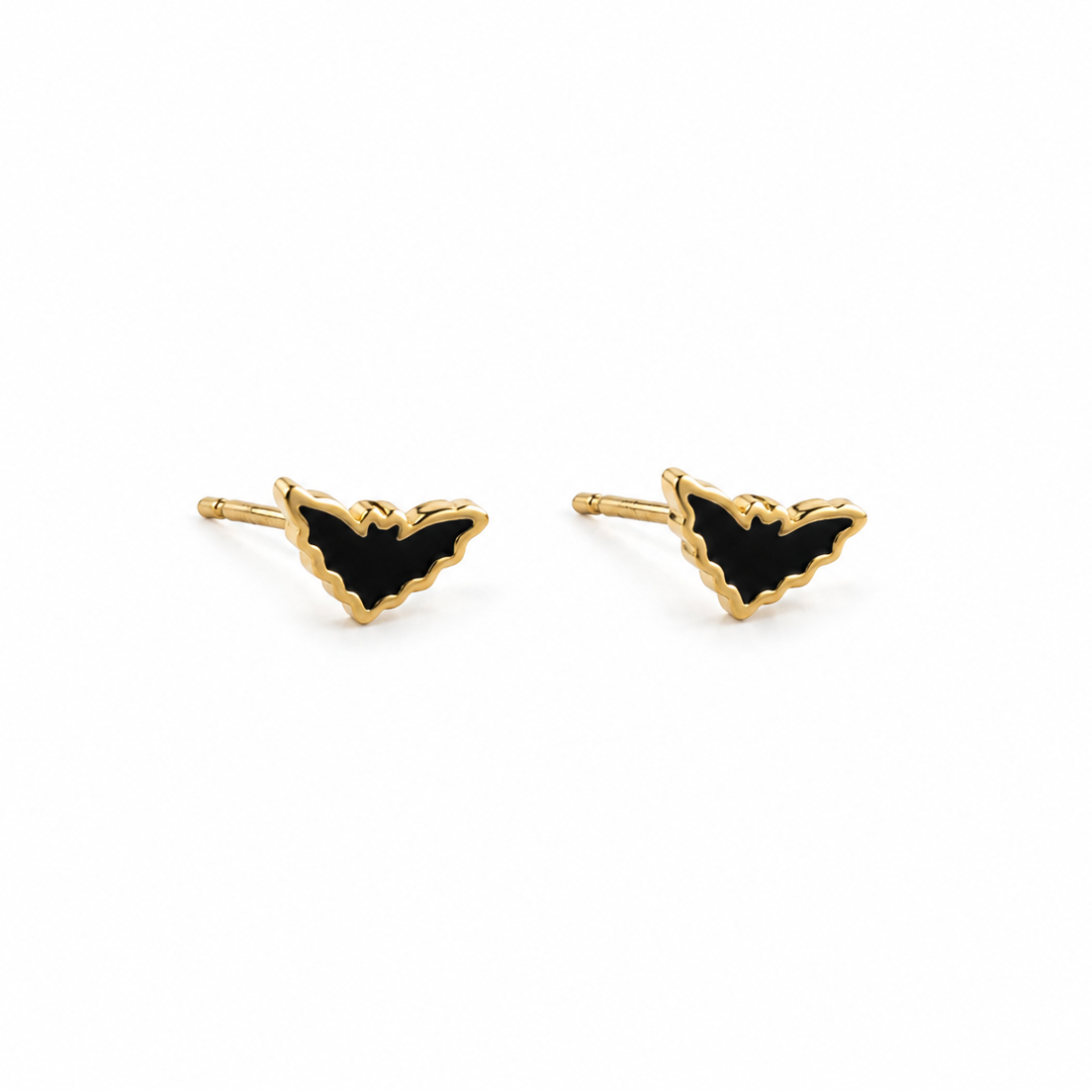 A pair of gold bat stud earrings with black enamel fill, shown on a plain white background.